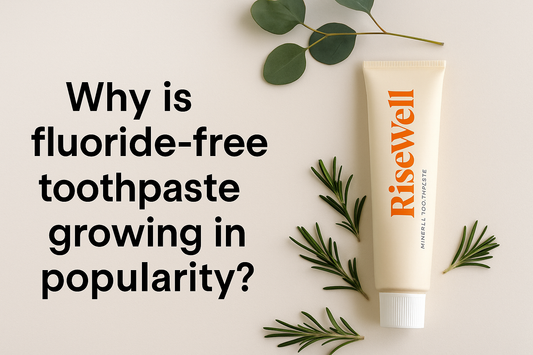Fluoride-free toothpaste displayed with fresh mint leaves on a clean, minimalist background, symbolising natural oral care and non-toxic, gluten-free personal hygiene products.